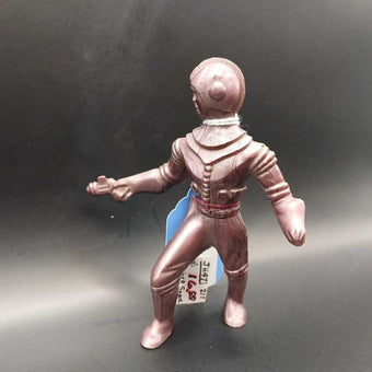 50's Archer space man with ray gun in right hand