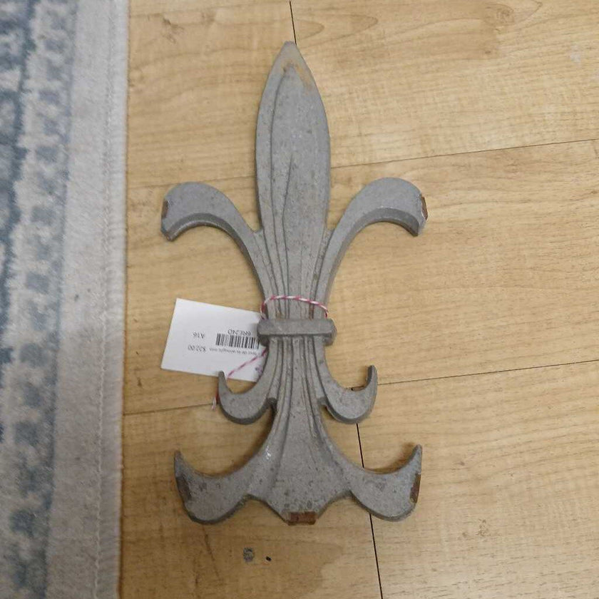 TM fleur de lis wrought iron