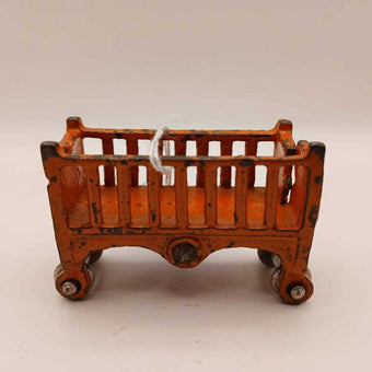 1920's orange Baby Doll crib with wheels