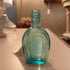 Lt. blue Horseshoe shaped bottle