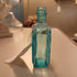 Light Blue Horseshoe Shaped Bottle