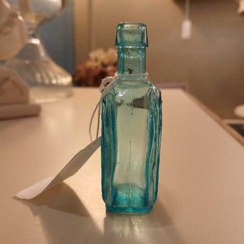 Lt. blue Horseshoe shaped bottle