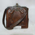 Tooled leather wristlet purse