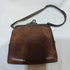 Tooled leather wristlet purse