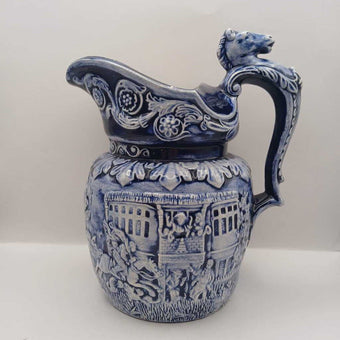 Blue pitcher with horse head on handle