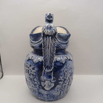 Blue pitcher with horse head on handle