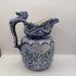 Blue pitcher with horse head on handle
