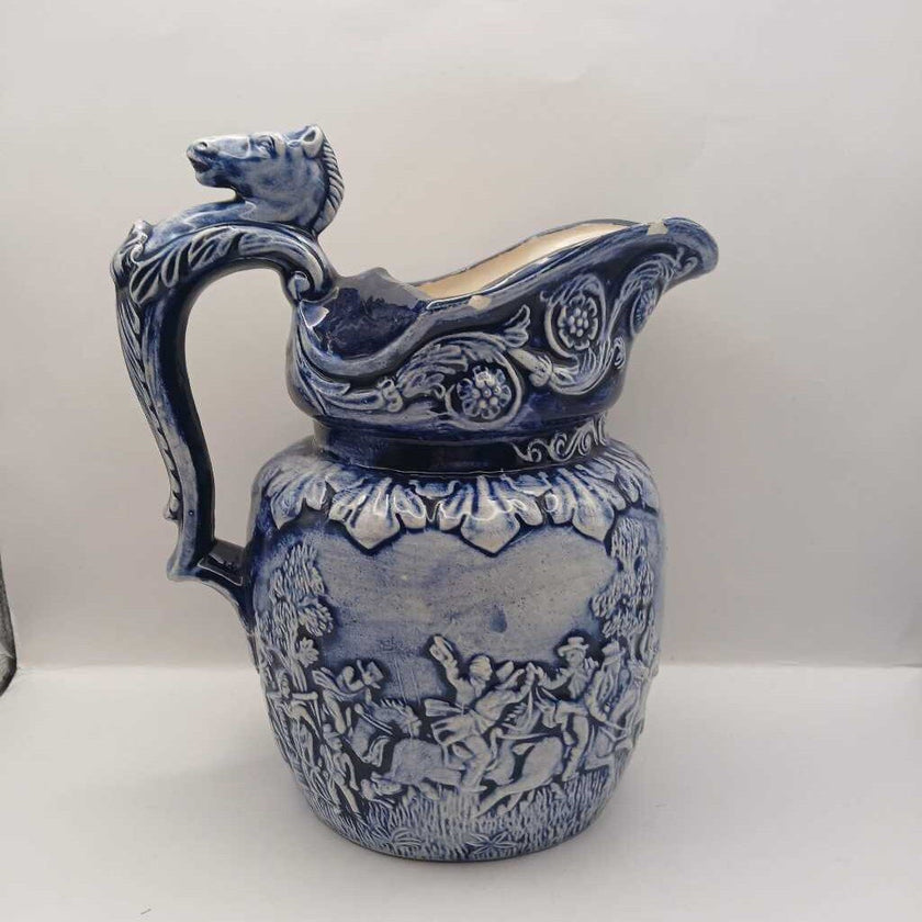 Blue pitcher with horse head on handle
