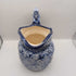 Blue pitcher with horse head on handle
