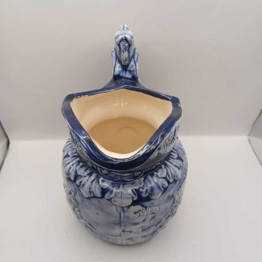 Blue pitcher with horse head on handle