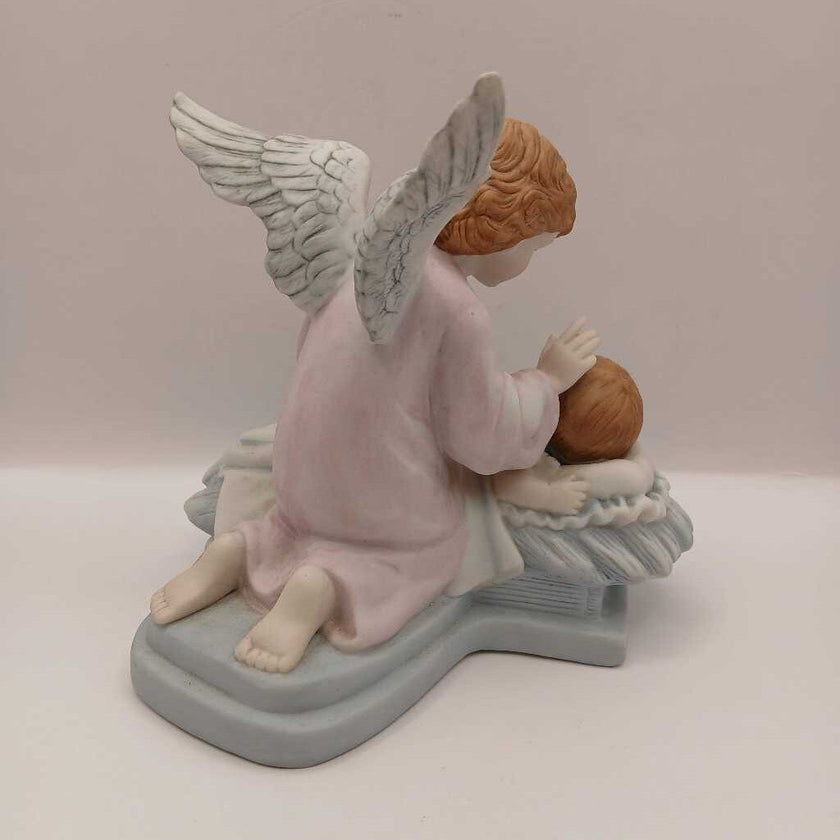 Guardian angel and child figurine