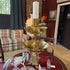 Brass footed double bowl candlestick