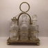 A18. Vintage condiment set from England. 6 cut glass jars and lids and 1 spoon