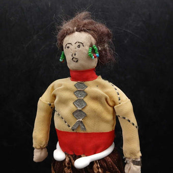 Navajo doll circa 1900 with bead earrings, tin cuff and breastplate