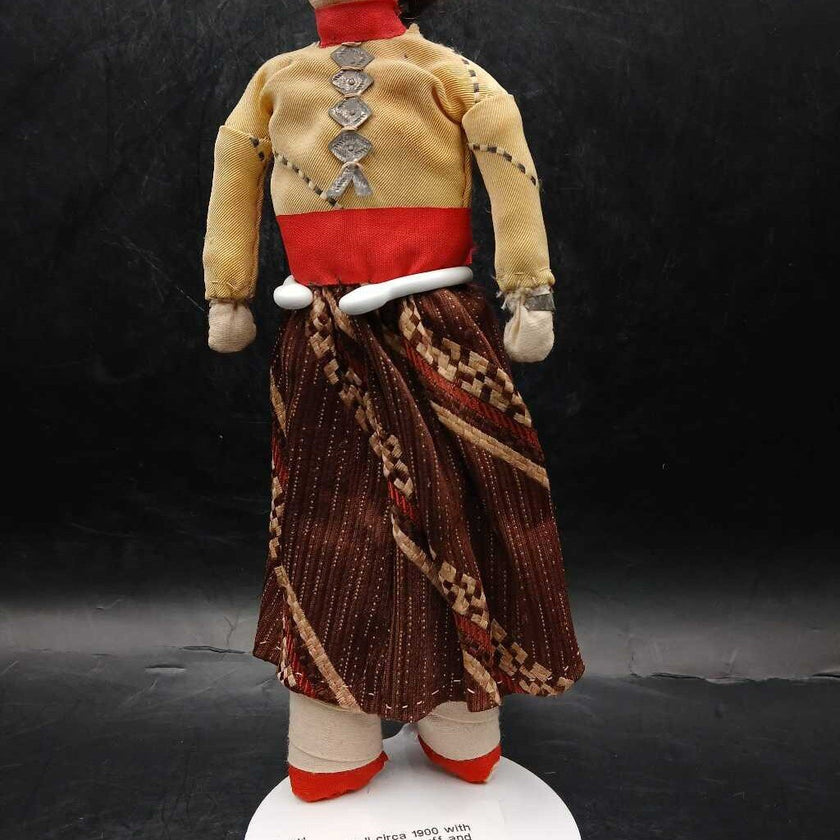 Navajo doll circa 1900 with bead earrings, tin cuff and breastplate