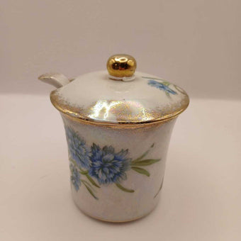 Vintage floral condiment jar with spoon and lid