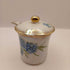 Vintage floral condiment jar with spoon and lid