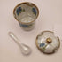 Vintage floral condiment jar with spoon and lid