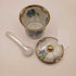 Vintage floral condiment jar with spoon and lid