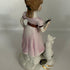Vintage Capodimonte style porcelain figurine of a girl with a cat, Italy