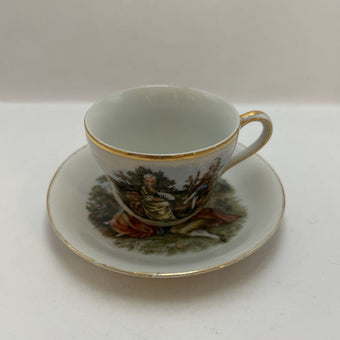 Vintage Occupied Japan porcelain demitasse cup and saucer with courting couple scene