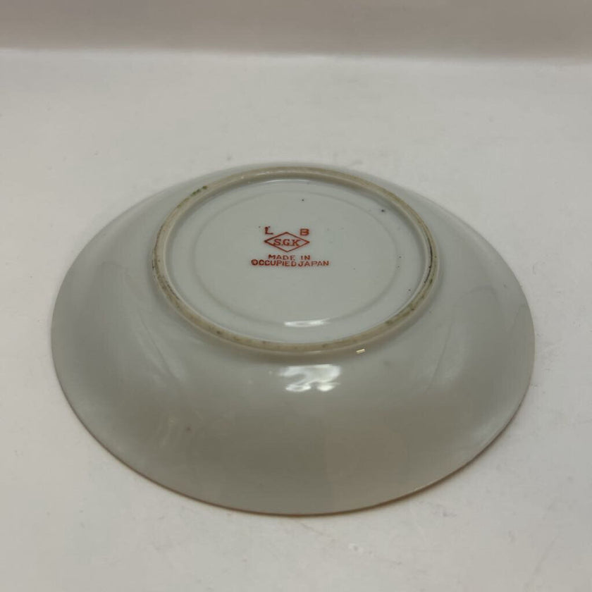 Vintage Occupied Japan porcelain demitasse cup and saucer with courting couple scene