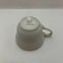 Vintage Occupied Japan porcelain demitasse cup and saucer with courting couple scene