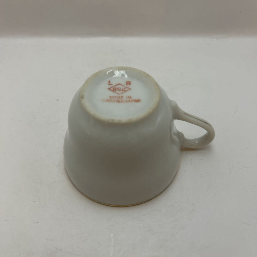 Vintage Occupied Japan porcelain demitasse cup and saucer with courting couple scene