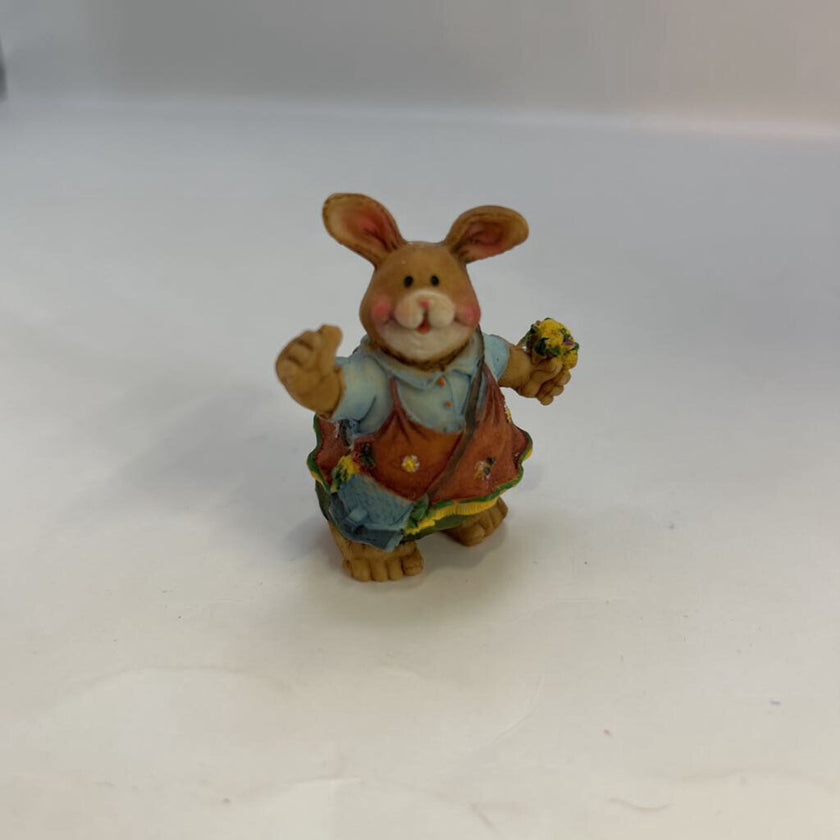 Miniature Rabbit Holding Flowers