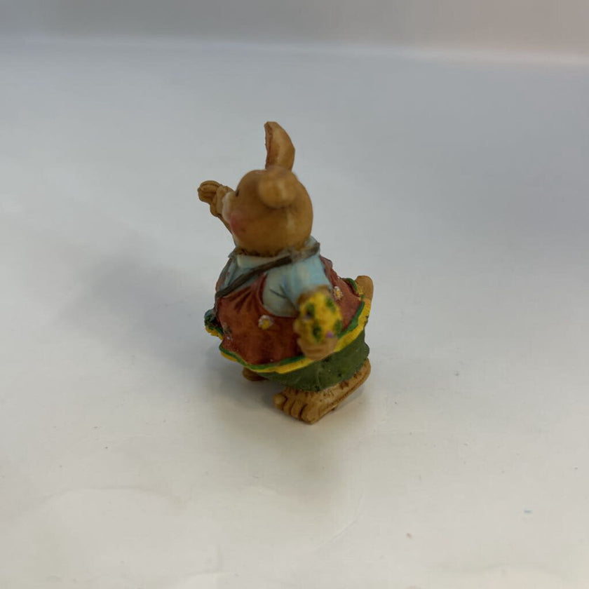 Miniature Rabbit Holding Flowers