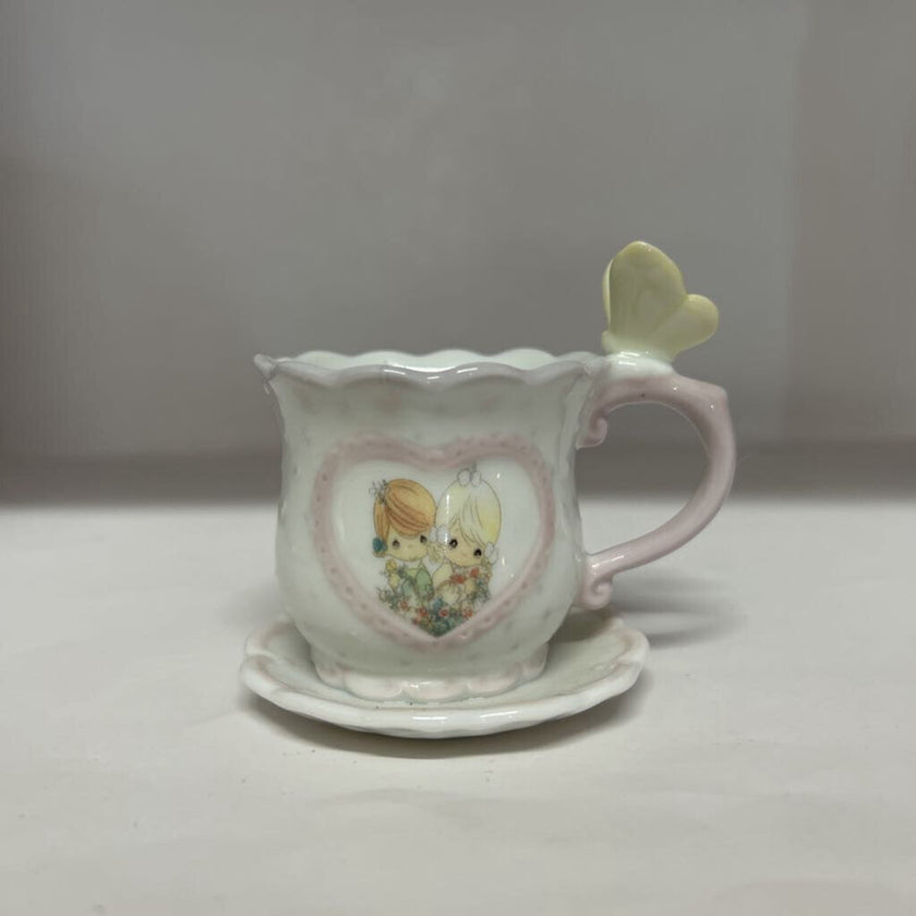 Precious moments cup and saucer