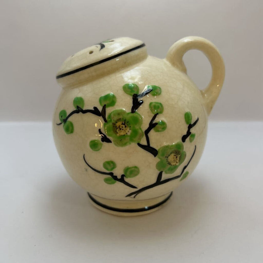 Vintage hand-painted ceramic shaker with green floral design, made in Japan.