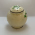 Vintage hand-painted ceramic shaker with green floral design, made in Japan.