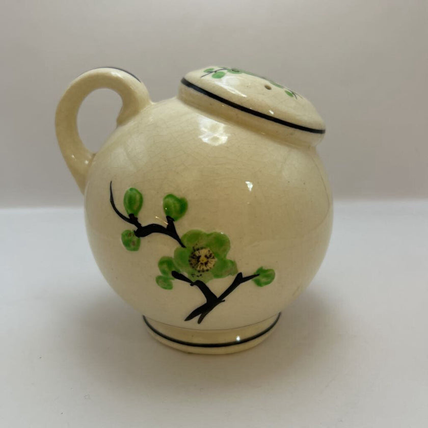 Vintage hand-painted ceramic shaker with green floral design, made in Japan.