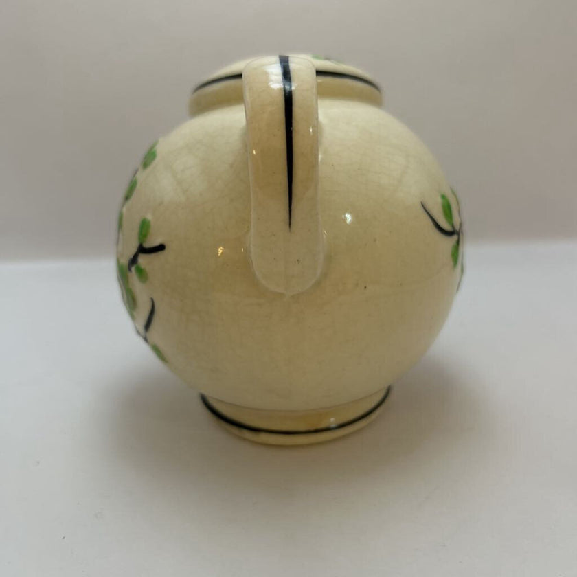 Vintage hand-painted ceramic shaker with green floral design, made in Japan.