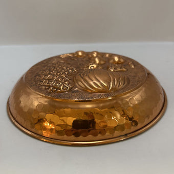 Vintage Italian copper jelly mold with embossed pineapple and fruit design.