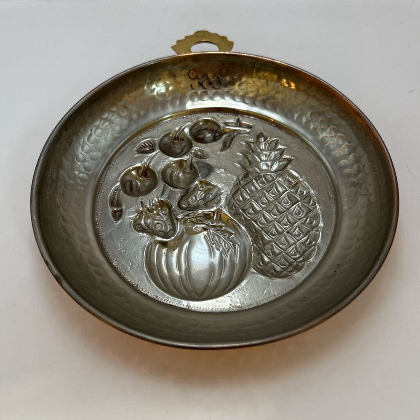 Vintage Italian copper jelly mold with embossed pineapple and fruit design.