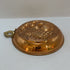 Vintage Italian copper jelly mold with embossed pineapple and fruit design.