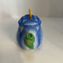 Miniature ceramic Avon teapot shaped like a blue tulip with a butterfly lid