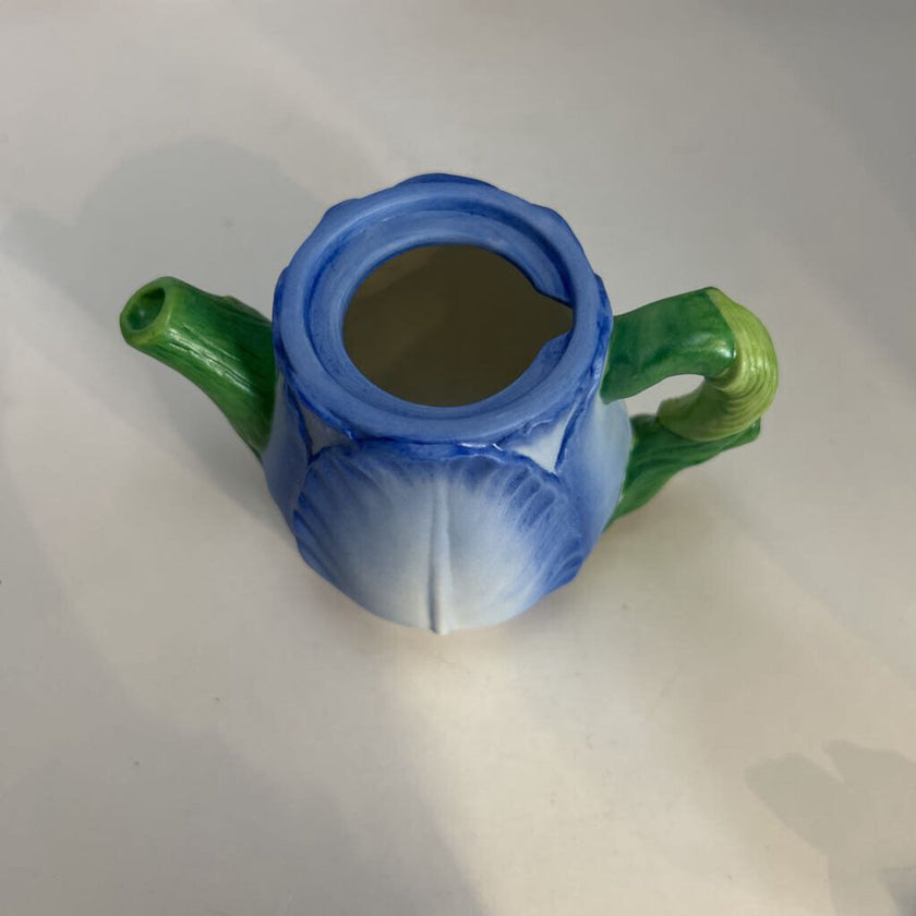 Miniature ceramic Avon teapot shaped like a blue tulip with a butterfly lid