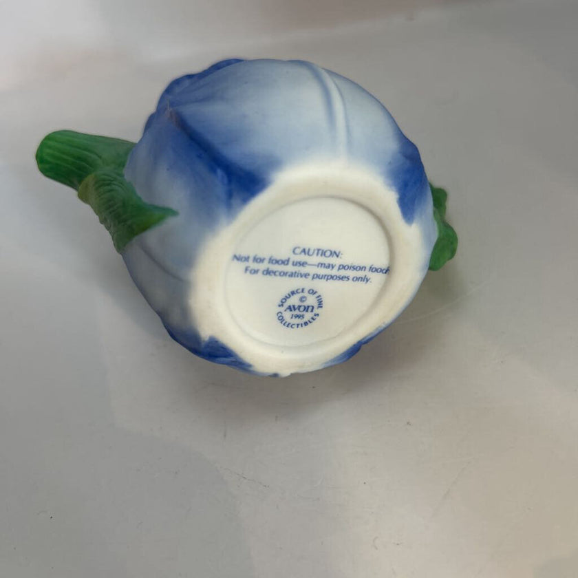 Miniature ceramic Avon teapot shaped like a blue tulip with a butterfly lid