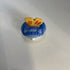 Miniature ceramic Avon teapot shaped like a blue tulip with a butterfly lid